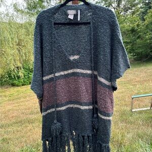 Free People poncho with tassels. Oversized; one size fits all in gray and mauve
